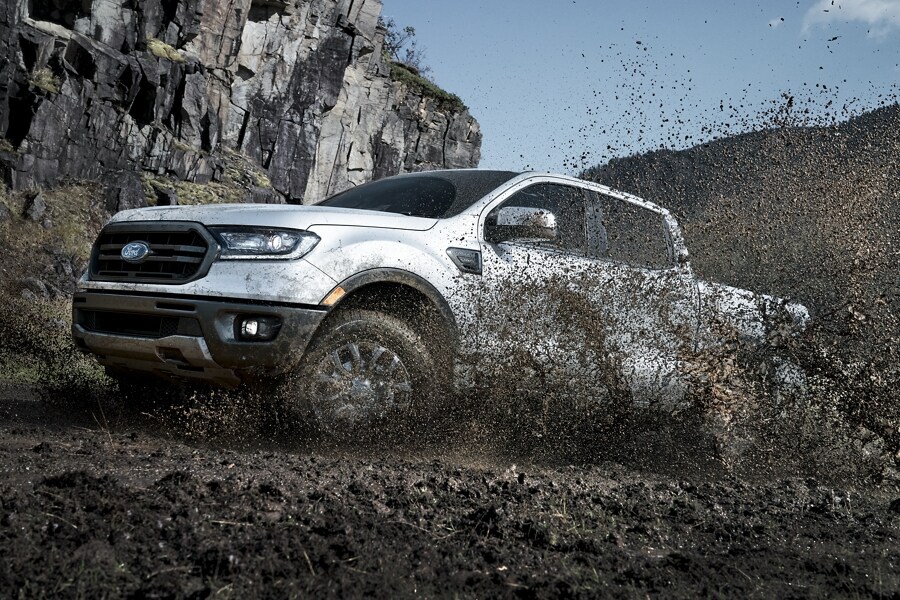 2023 Ford Ranger® in Iconic Silver being driven in the mud