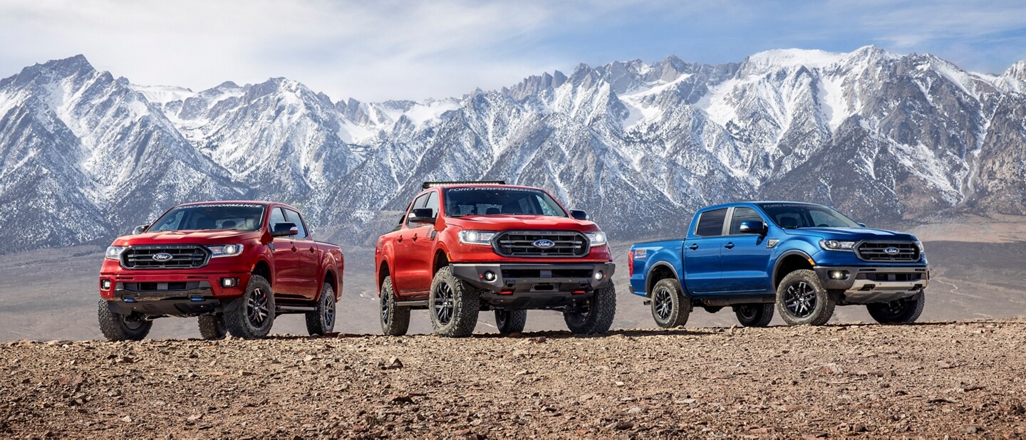 Three 2023 Ford Ranger® trucks parked in front of a snowy mountain
