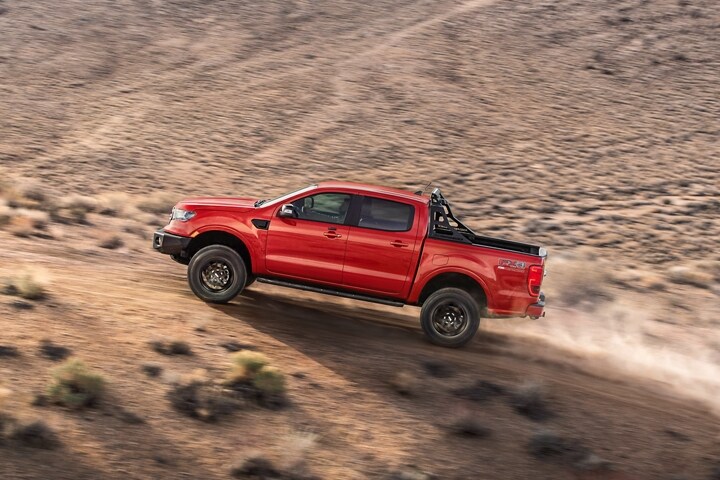 2023 Ford Ranger® in Race Red being driven fast down a desert trail