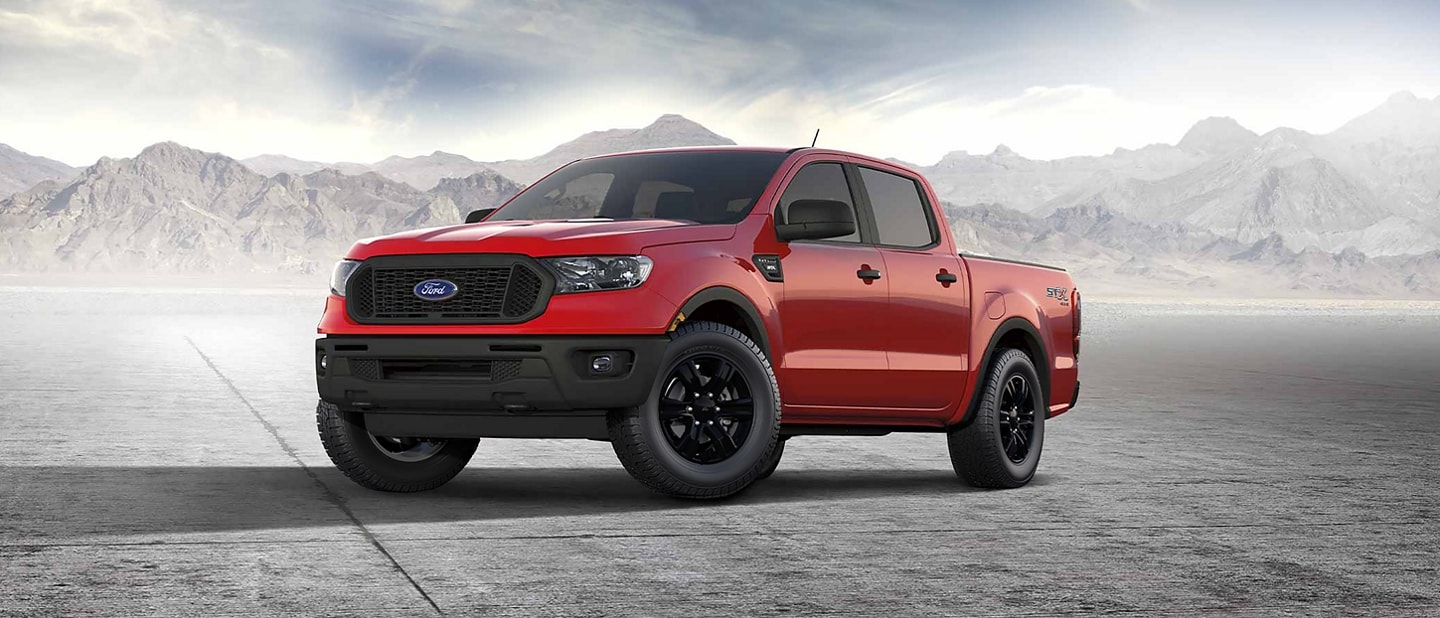 2023 Ford Ranger® in Race Red driving down a dirt road