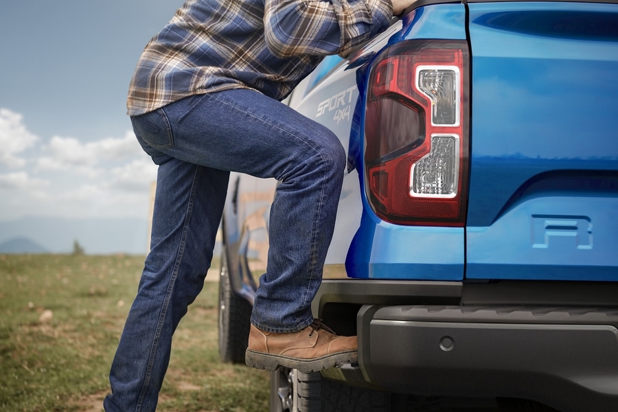 A 2024 Ford Ranger® with the BoxSide Step being demonstrated by a person