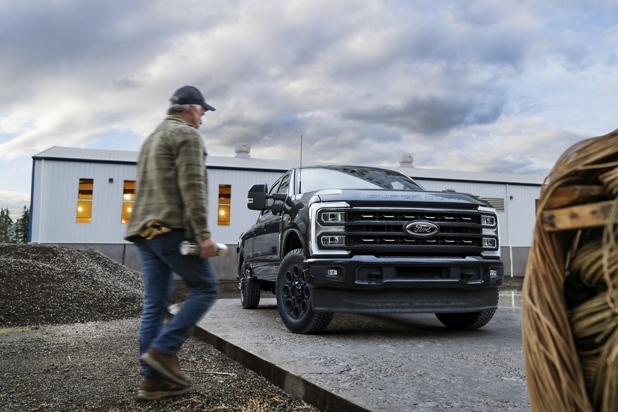 Man walking toward a parked 2023 Ford Super Duty® F-450® Limited