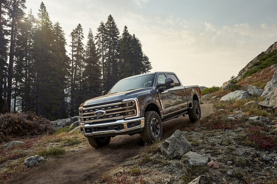 2023 Ford Super Duty® F-250 Tremor Off-Road Package being driven over a rocky path