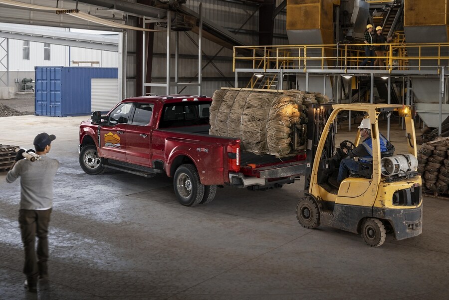 2023 Ford Super Duty® F-350 with a load being placed into the bed