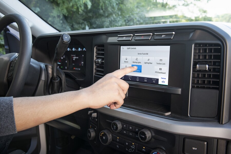 Close-up of the 8" display screen showing the upfit controls