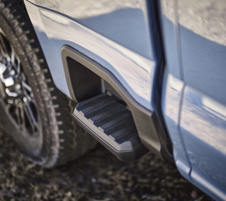 Close-up of the box side step on a 2023 Ford Super Duty® pickup
