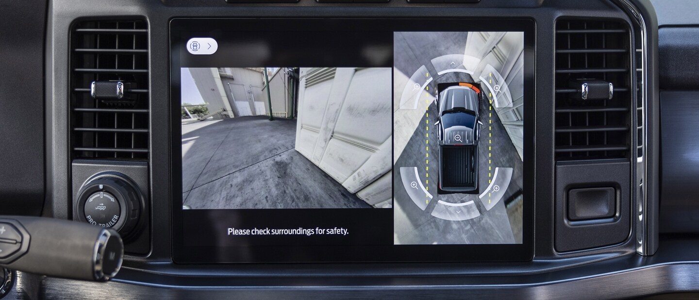 Close-up of the centre display screen showing a 360-degree camera view
