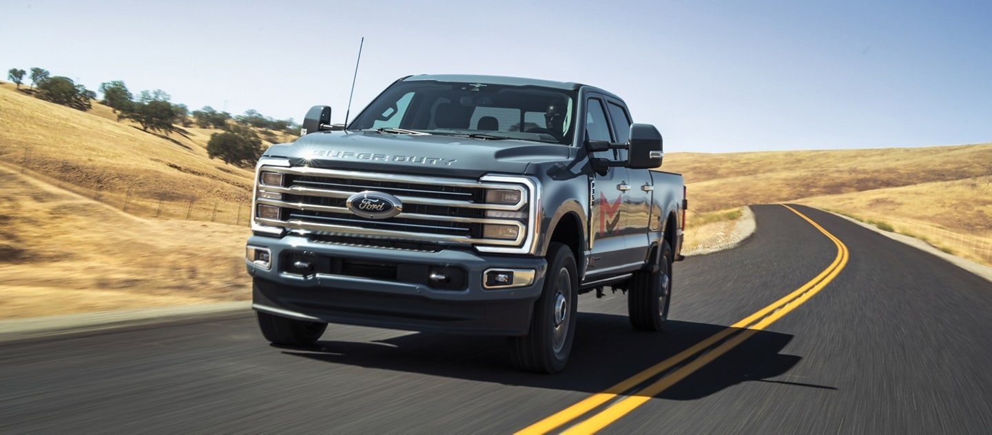 2024 Ford Super Duty® F-250® LARIAT® being driven on a two-lane road