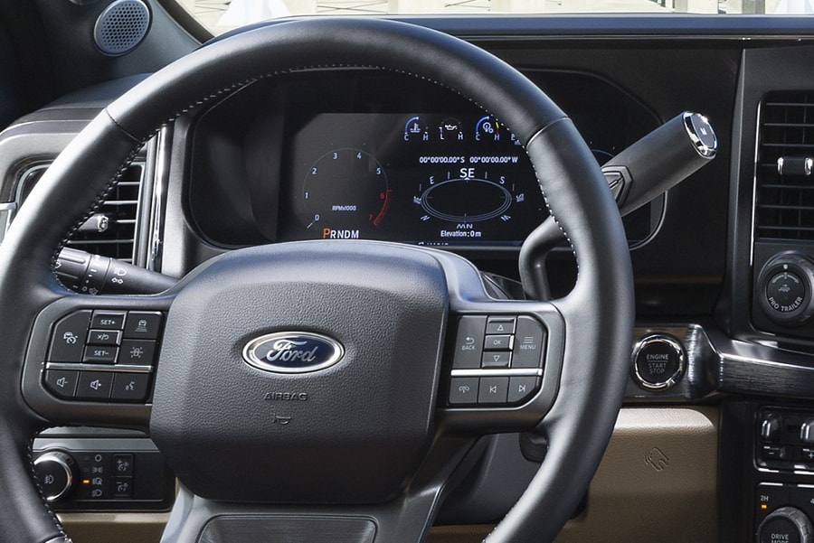 Close-up of steering wheel and instrument cluster