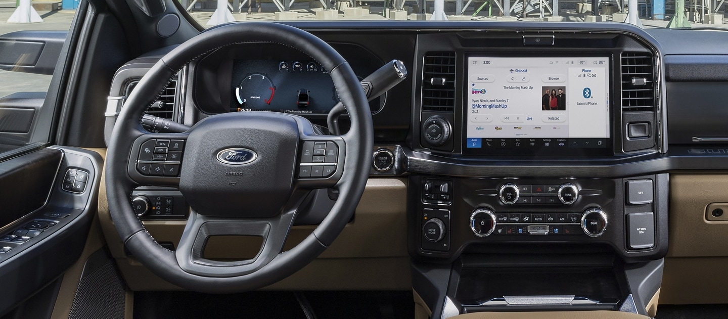 Interior of a 2025 Ford Super Duty® F-350® LARIAT® pickup parked near silos