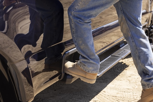 Close-up of a person stepping onto the box side step feature