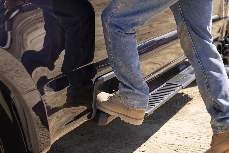 Close-up of a person stepping onto the box side step feature