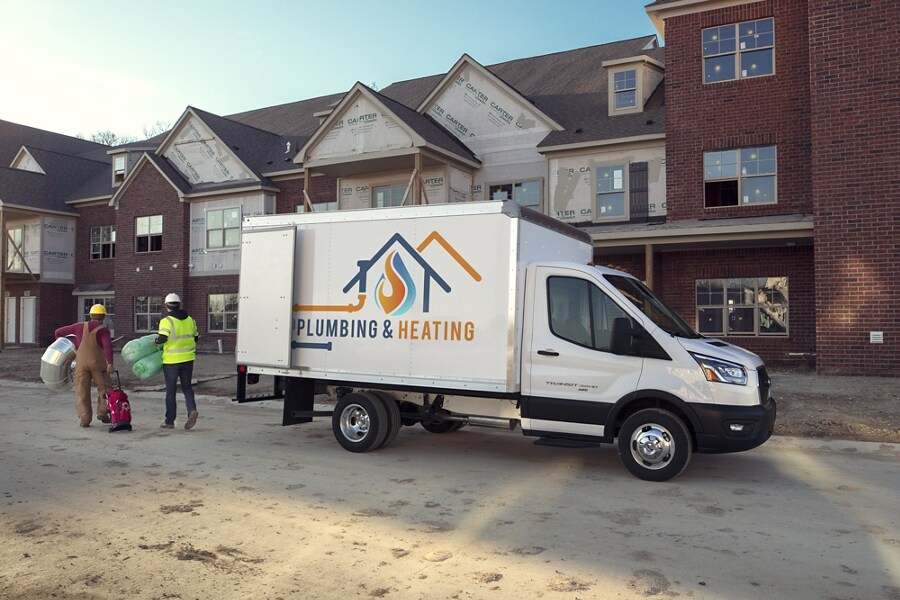 2023 Ford Transit® Chassis Cab box truck upfit on a new build site with workers