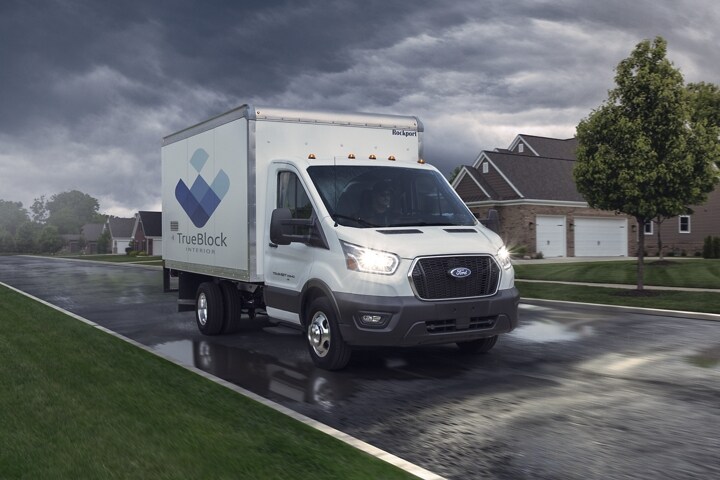 2023 Ford Transit® cutaway with box truck upfit being driven on a stormy day