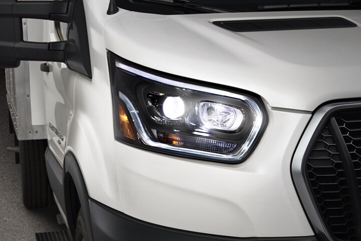 A close-up of the HID headlamps on a 2024 Ford Transit® Cutaway model