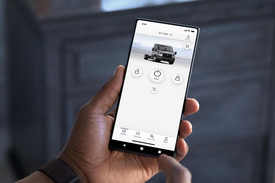 Person holding a smartphone using the available FordPass® App