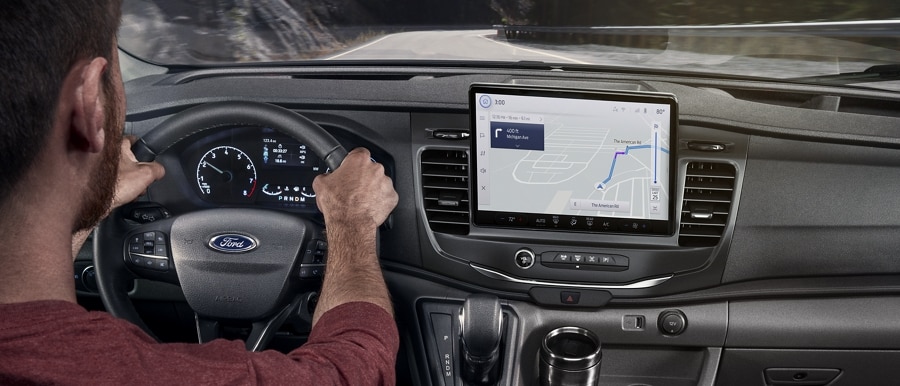 Person driving a 2025 Ford Transit® model with available SYNC® 4 and 12-inch multi-function display