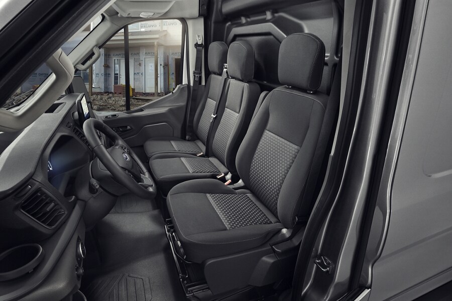 The interior of a 2023 Ford Transit® Van with a 3-passenger front seat