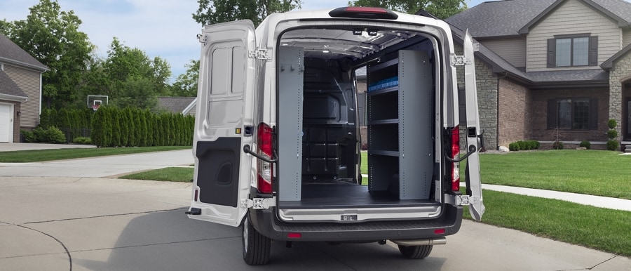 A rear shot of a 2023 Ford Transit® Van with the rear doors open