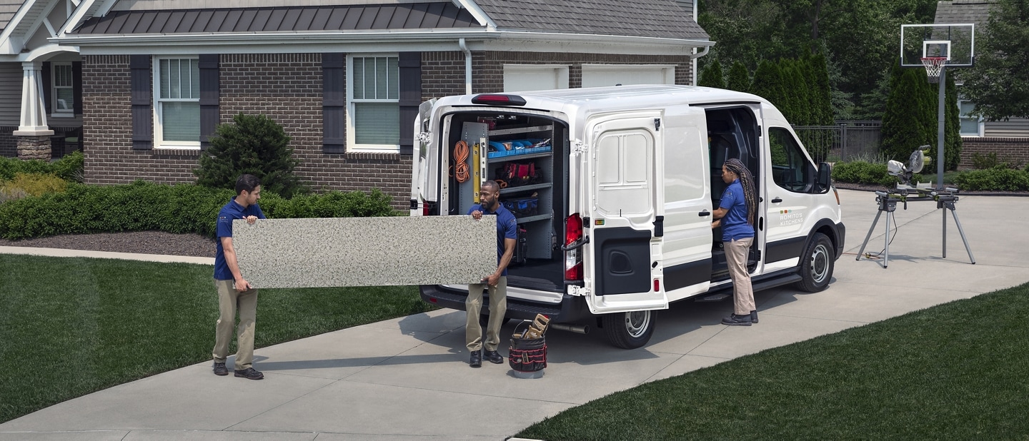 A group of people unloading a 2023 Ford Transit® Van