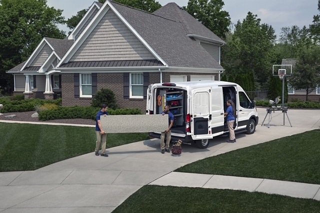 A group of people unloading a 2023 Ford Transit® Van