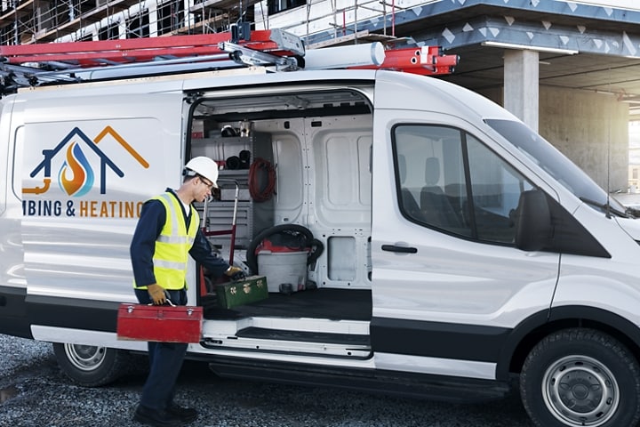 A worker loading equipment into a parked 2023 Ford Transit® Cargo Van