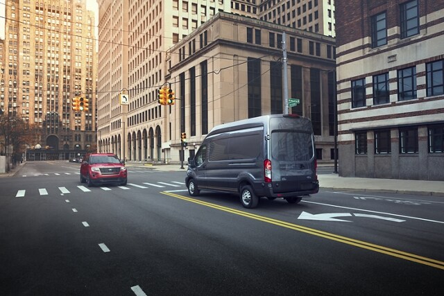 2023 Ford Transit® Cargo Van stopped on a city street