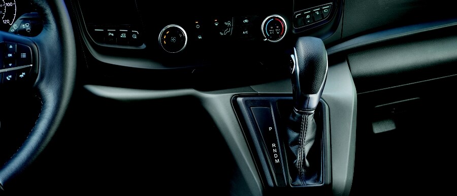Interior shot of the centre console right shifter in a 2023 Ford Transit® Van