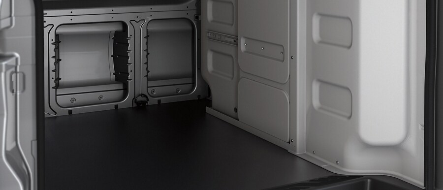 Shot of heavy-duty flooring covering the cargo area of a 2023 Ford Transit® Van