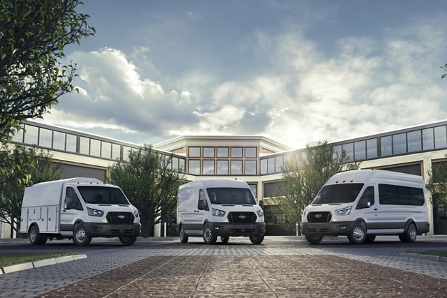 Three 2024 Ford Transit® Vans parked outside an office building