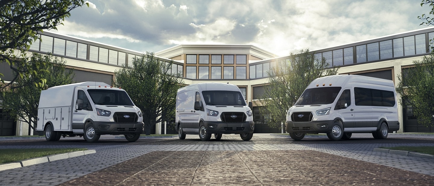 Three 2025 Ford Transit® Vans parked outside an office building