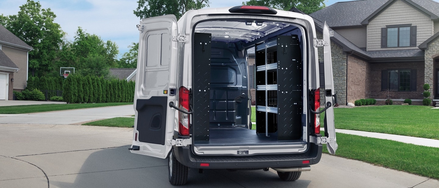 A 2025 Ford Transit® van with doors open showing all the cargo space