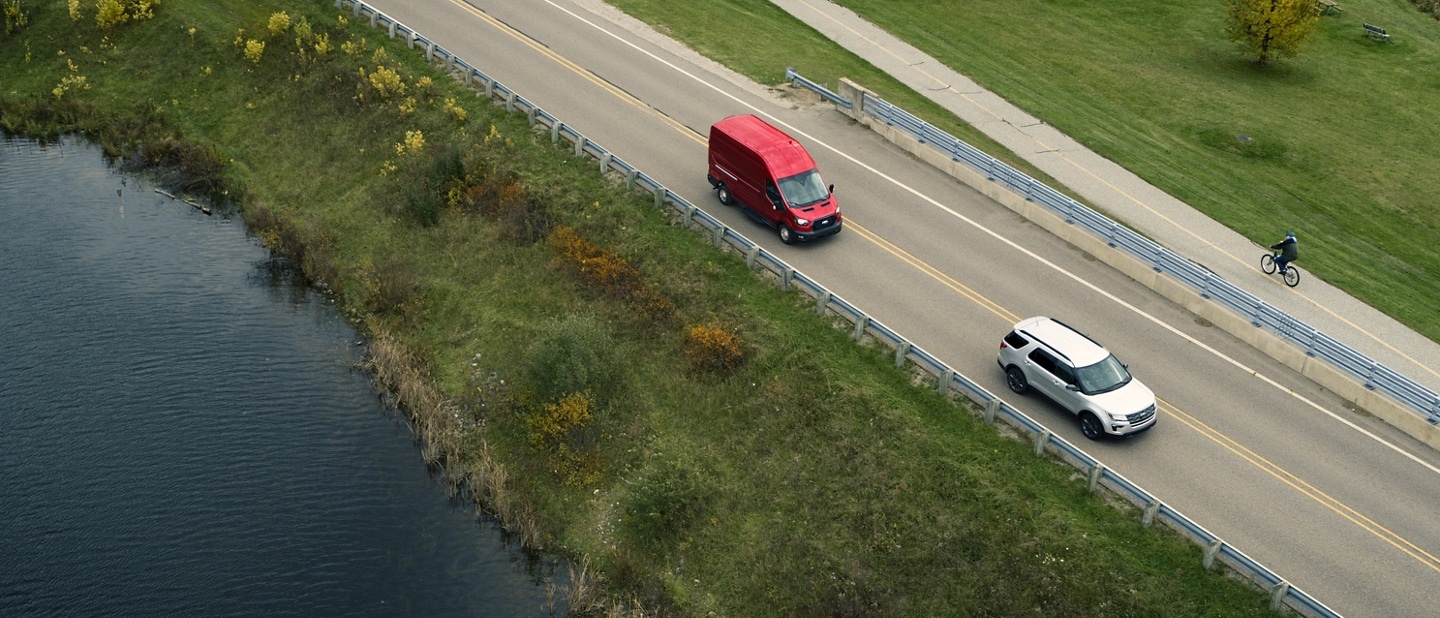 Birds-eye view of a 2025 Ford Transit® van being driven on a highway