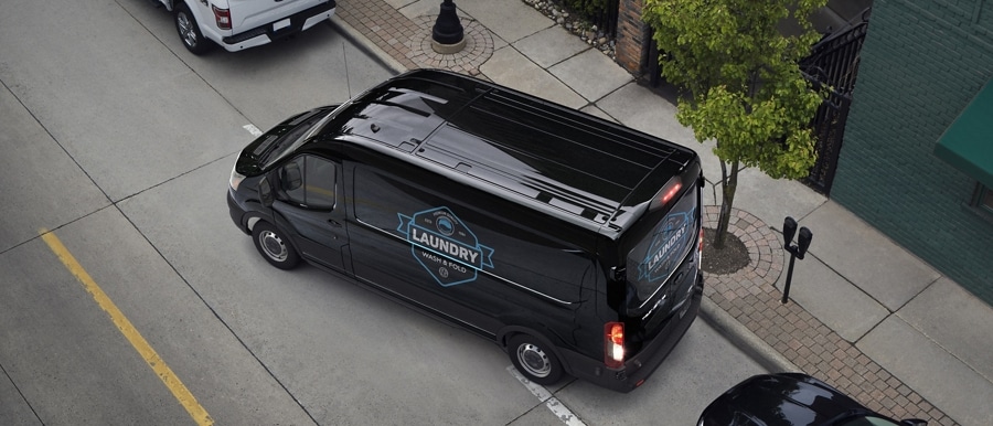 A 2025 Ford Transit® van being parallel parked
