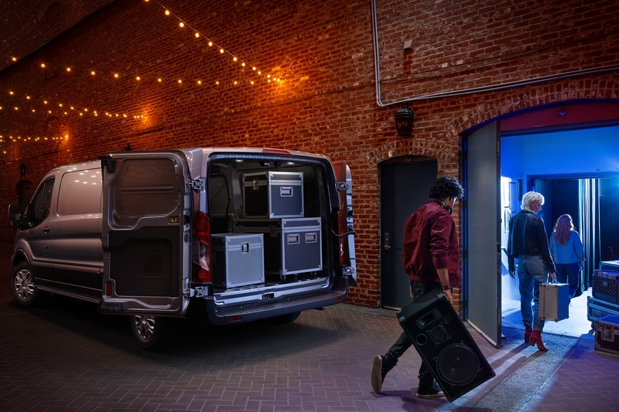 Back of 2025 Ford Transit® van shown with doors open and cargo in back