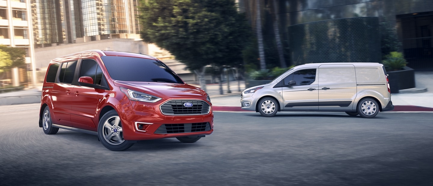 A 2023 Ford Transit Connect Passenger Wagon in Race Red and a 2023 Ford Transit Connect Cargo Van in Silver