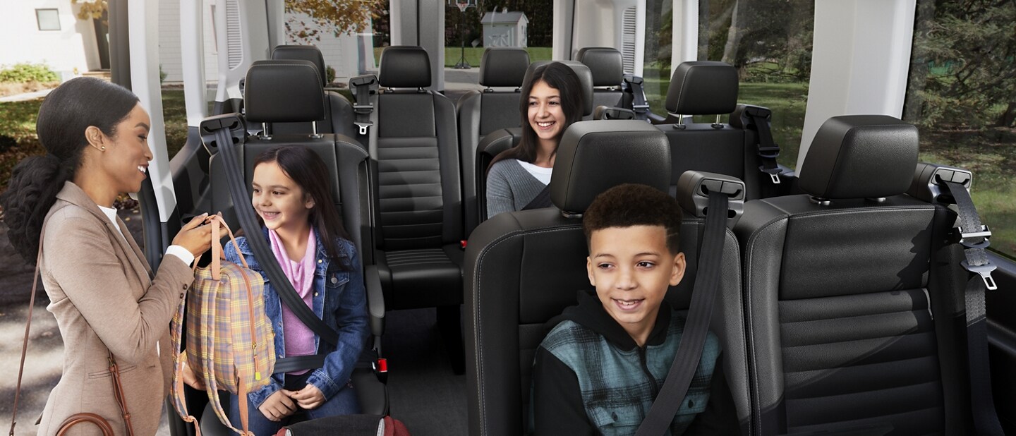 People entering a 2023 Ford Transit® van