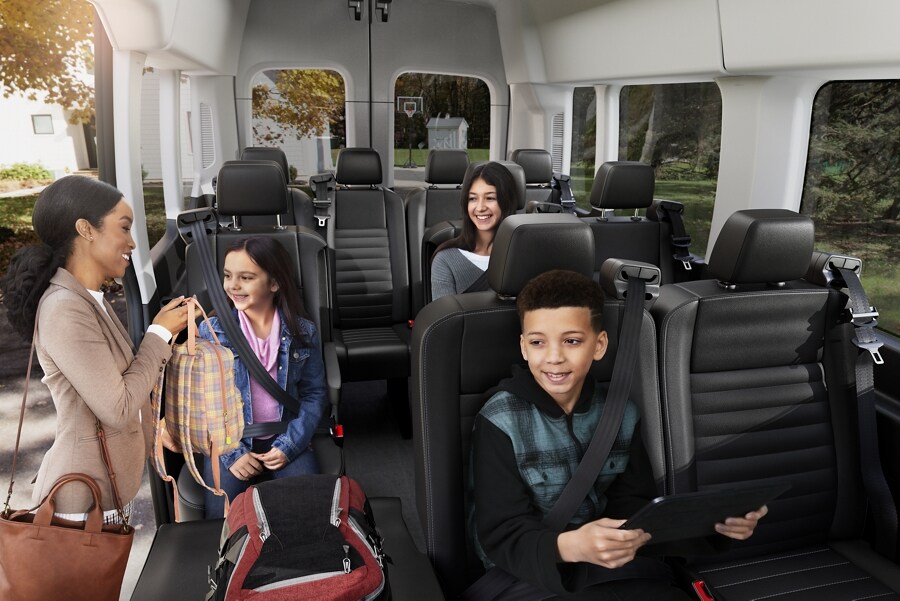 People entering a 2023 Ford Transit® van