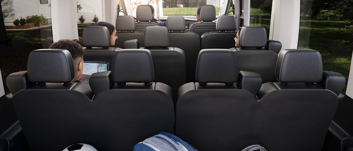 The interior of a 2023 Ford Transit® van with the cargo area filled with sports gear