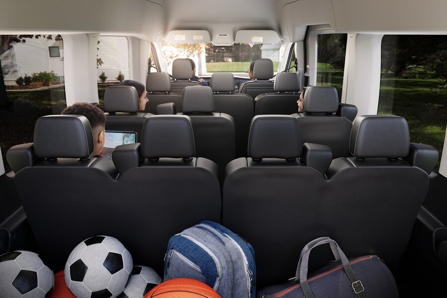 The interior of a 2023 Ford Transit® van with the cargo area filled with sports gear
